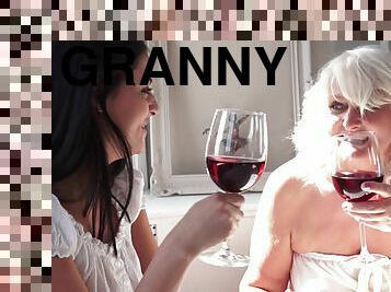 Chubby granny seduces a cute college girl and fucks her