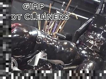 Rubber Gimp Boot Cleaners - Lady Bellatrix makes her two gimps compete for her attention