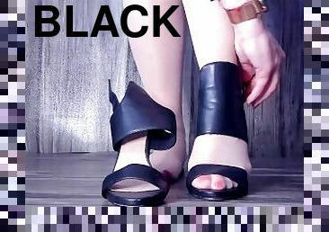 Mistress Inni is teasing you with her open black sandal high heels
