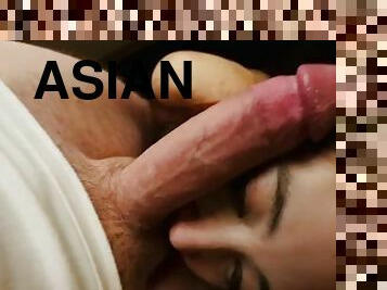 Little Asian slut sucking big white cock