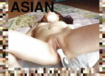 Asian masturbates with toy and squirts 1