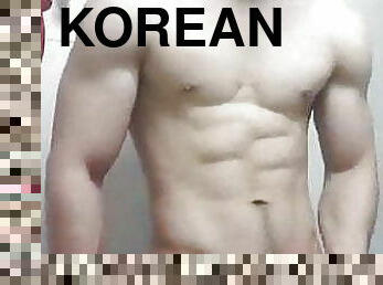 Fit korean shows his armpits and biceps, wanks and cums