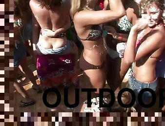 Party girls get topless and dance at a wild outdoor party