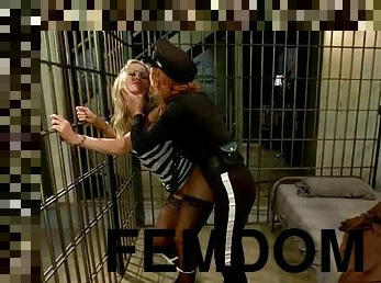 Cute blonde gets her ass whipped and toyed by female cop in a jail
