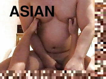 Asian beefy muscle boy riding a big cock