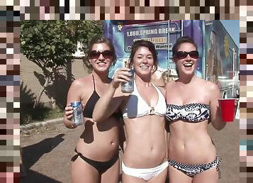Arousing amateurs in glasses getting drunk in public at a beach party outdoor