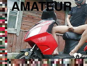 Biker girl masturbates on her red motorcycle