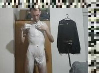 Very skinny teen applies shaving cream on his body and his cock