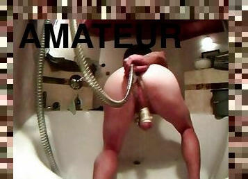 enema bondage slave squirting water out ass with bound cock in balls.
