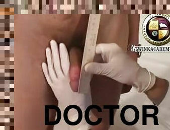The doctor inspects the boys foreskin during his medical exam