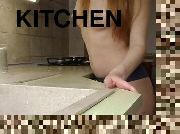 A friend Shoots how a Naked beauty cleans up in his kitchen.