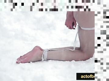 Naked barefoot Greta tied up in the snow.