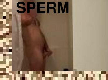 Jerk off in the hotel shower and cum on the wall