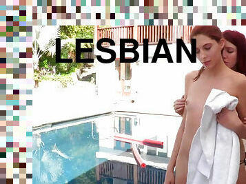 Cute redhead girls Ashley Scott and Elle Alexandra have lesbian sex by the pool