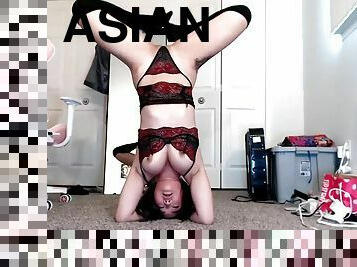Flexible Asian with big tits exercises and does handstand on webcam