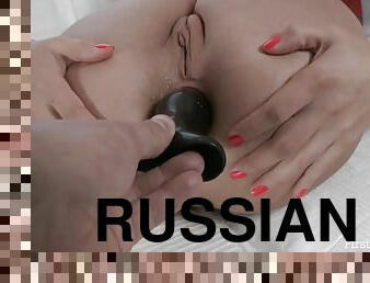 Russian teen uses a buttplug to prepare her ass for anal sex