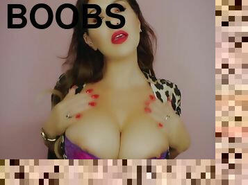 Brunette hottie shows off her giant boobs in sexy bra