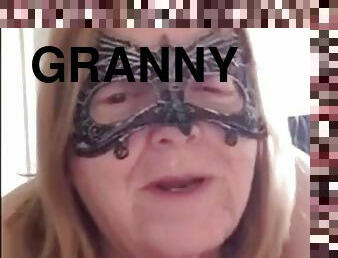 Granny has a bright red pussy and a big strapon