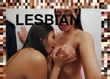 Two babes satisfy their lesbian fantasies in a changing room