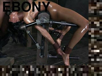 Ebony oiled and tied mercilessly in BDSM porn shoot