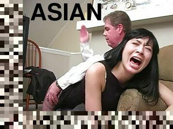 Asian teacher spanked to tears