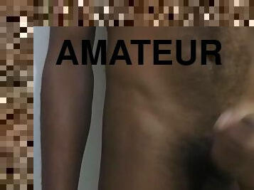 Young male masturbation on a camera behind a white background 