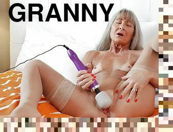 Granny toys her shaved cunt in ways that seem so addictive