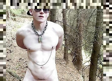 Slave hiking naked and locked in a forest