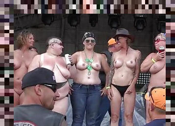 Biker babes topless on stage dancing for the guys