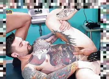 Inked stud bareback and fisted in 3some at the doctors office