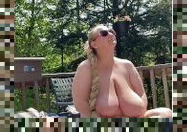 Letting my neighbor watch me sunbathe topless on the deck