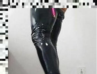 sissy ts rolls and masturbates in high heels and latex pants