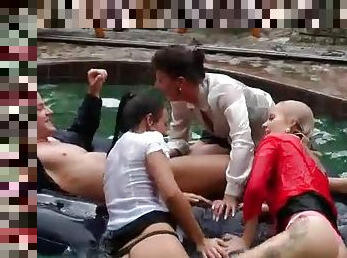 Clothed lesbian orgy in the pool