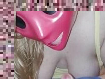 She sucks my cock through her pink purge mask