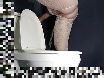 Weird way to pee in the toilet