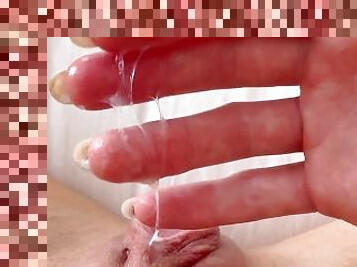 Stringy slimy juices flowing out of my homey pussy when I rub my clit and get orgasm