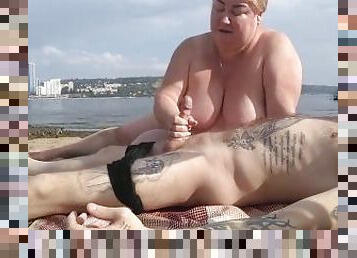 jerking off and sucking cock on a public beach