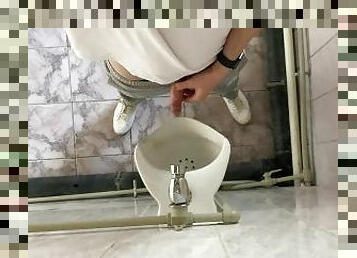 How guys pee in a urinal?
