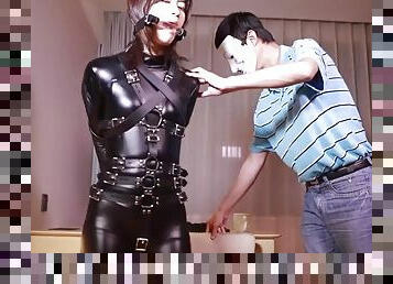 Fx-tube.com catsuit girl is gag in a variety of ways